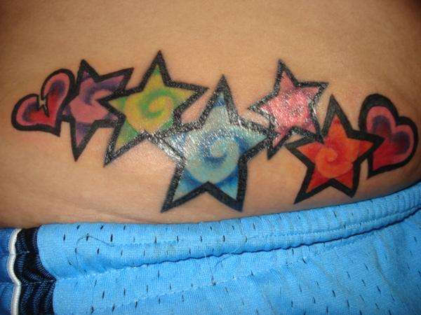 cross tattoos for women on back. cross and star tattoos. cross