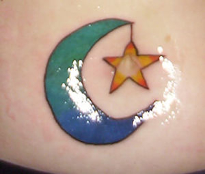 A moon and star tattoo done on