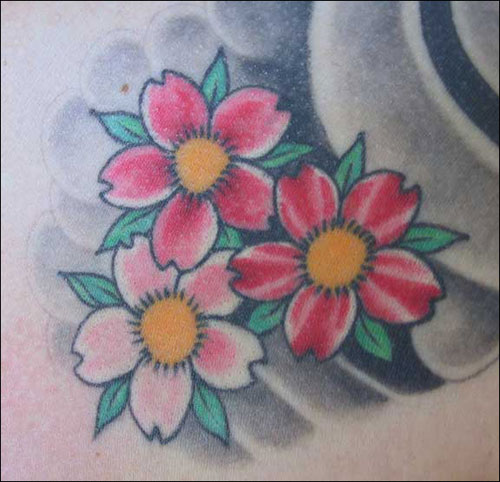 A huge rose flower tattoo for