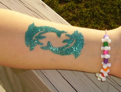 flower and dolphin tattoos