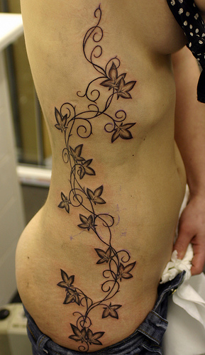 girl hip tattoos. girl flower tattoos. girl