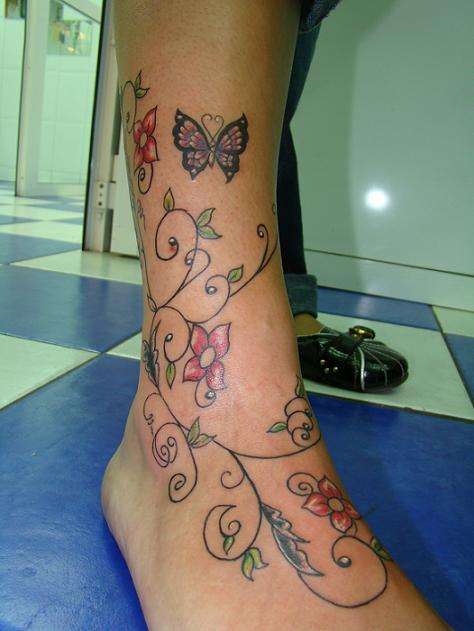 vine tattoo designs on foot. rose vine tattoos cross