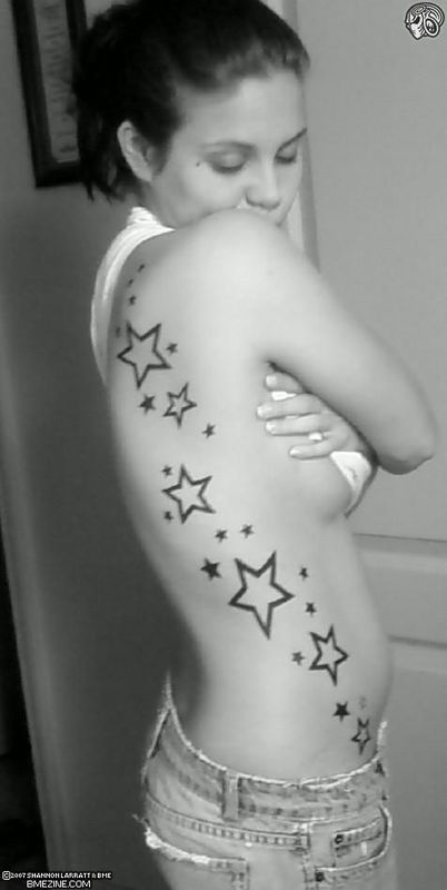 tattoos for women on side. star tattoos on side 