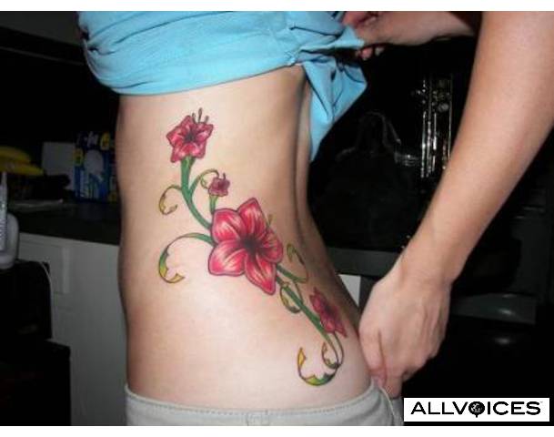 Tropical Flower with Stems Tattoos can be pretty and rather feminine looking 